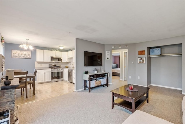 living area featuring baseboards, an inviting chandelier, and light colored carpet