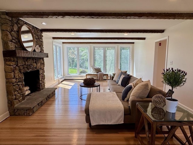 8 Melanie Ln, Mattapoisett, MA 02739 - living room featuring hardwood / wood-style floors, beamed ceiling, a stone fireplace, recessed lighting, and baseboard heating