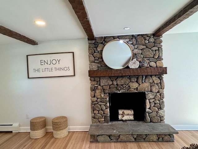 8 Melanie Ln, Mattapoisett, MA 02739 - detailed view of beam ceiling, wood finished floors, baseboard heating, and a fireplace