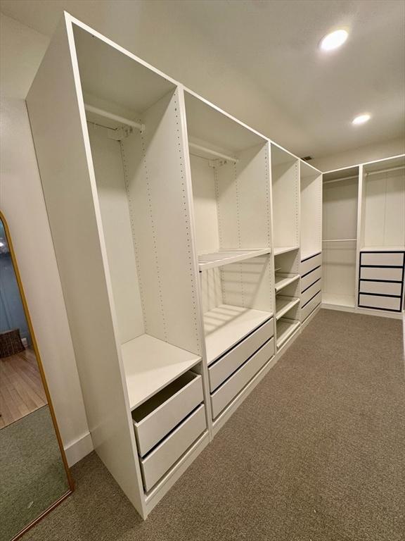 8 Melanie Ln, Mattapoisett, MA 02739 - walk in closet with dark carpet