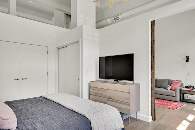 165 Chestnut Hill Ave Unit 3, Boston, MA 02135 - bedroom featuring wood finished floors and a high ceiling