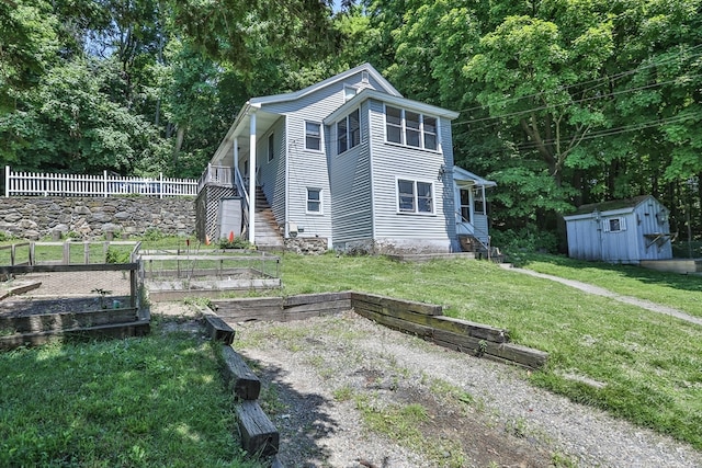 exterior space featuring a storage unit and a front lawn