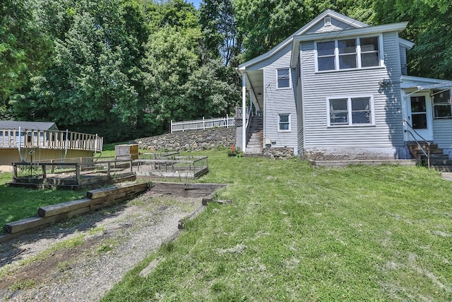 view of side of property featuring a lawn