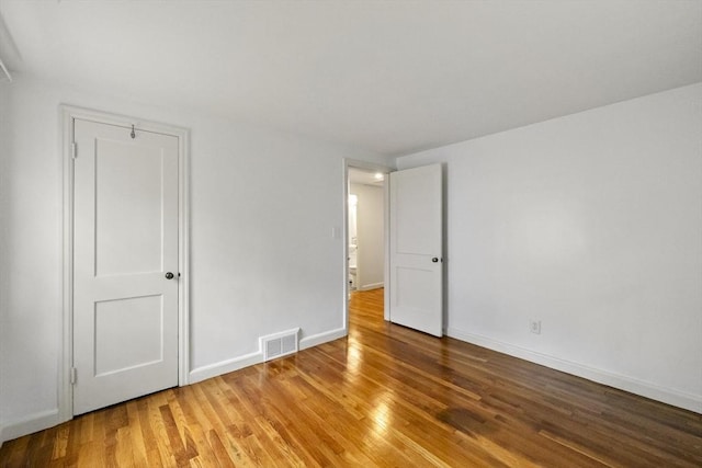 1652 Parker St, Springfield, MA 01128 - unfurnished bedroom featuring light wood-type flooring and baseboards