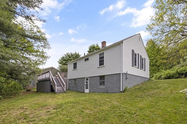 1652 Parker St, Springfield, MA 01128 - rear view of property featuring stairs, a chimney, a yard, and a wooden deck