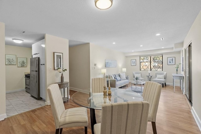 dining space featuring light hardwood / wood-style floors