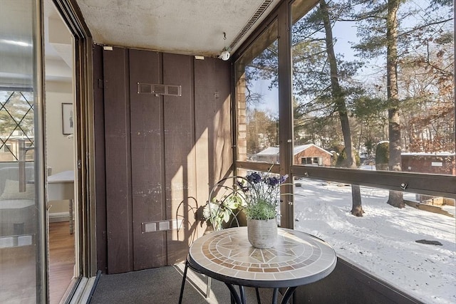 unfurnished sunroom with plenty of natural light