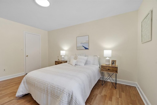 bedroom with hardwood / wood-style floors