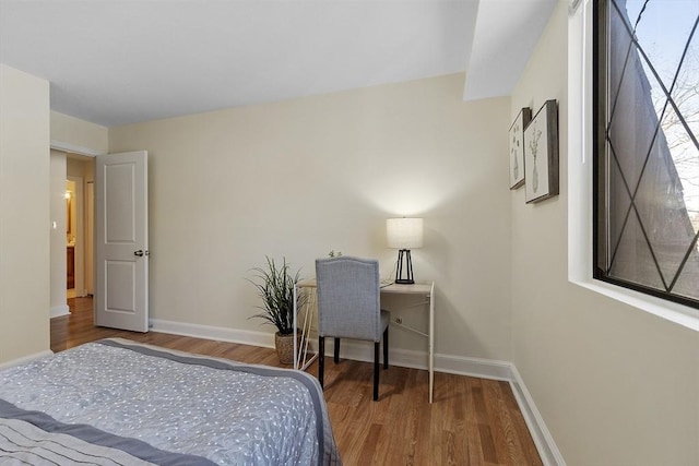 bedroom with wood-type flooring