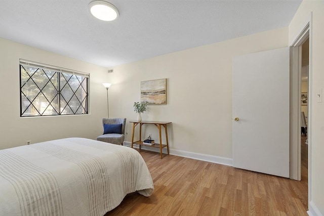 bedroom with light hardwood / wood-style floors