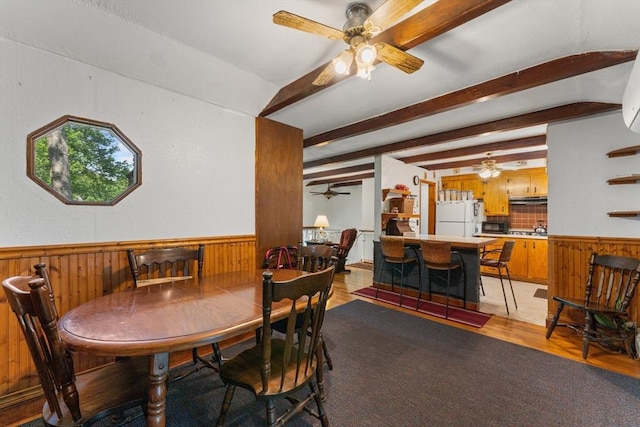 30 Stone St, Bellingham, MA 02019 - dining area featuring a ceiling fan, light wood finished floors, wainscoting, wooden walls, and beam ceiling