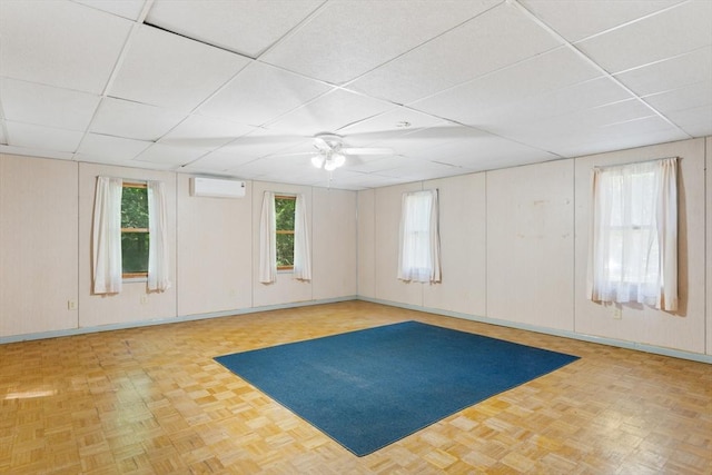 30 Stone St, Bellingham, MA 02019 - unfurnished room with a paneled ceiling, ceiling fan, and an AC wall unit
