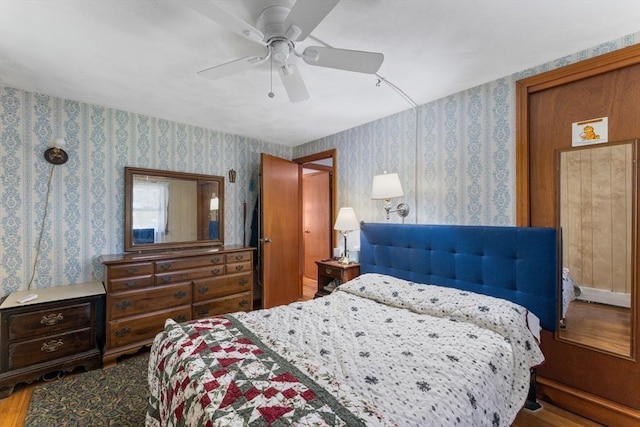 30 Stone St, Bellingham, MA 02019 - bedroom with wallpapered walls, wood finished floors, and ceiling fan