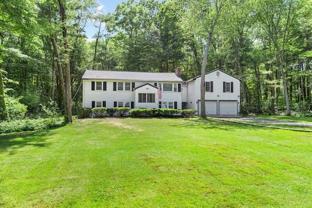 30 Stone St, Bellingham, MA 02019 - bi-level home featuring a garage, a chimney, driveway, and a front lawn
