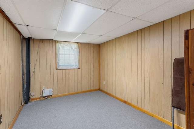30 Stone St, Bellingham, MA 02019 - empty room featuring a drop ceiling, wooden walls, and carpet floors