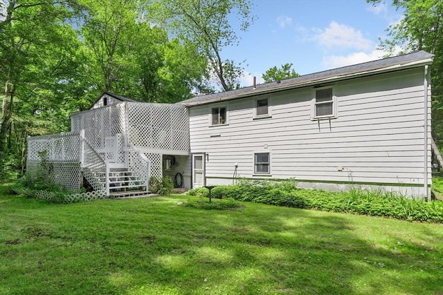 30 Stone St, Bellingham, MA 02019 - back of property with a lawn, a deck, and stairway