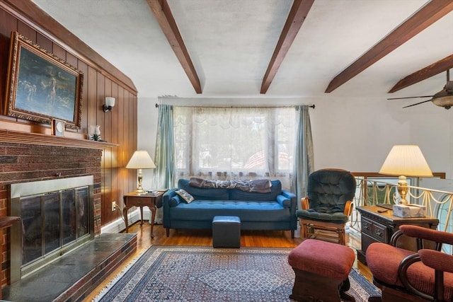 30 Stone St, Bellingham, MA 02019 - living area featuring beamed ceiling, wood finished floors, a fireplace, and a ceiling fan