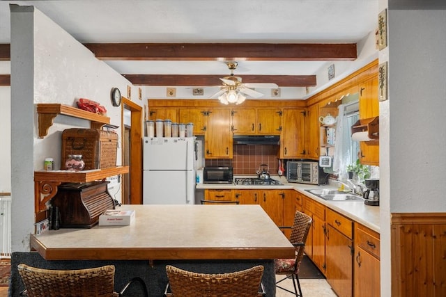 30 Stone St, Bellingham, MA 02019 - kitchen with freestanding refrigerator, light countertops, under cabinet range hood, tasteful backsplash, and ceiling fan