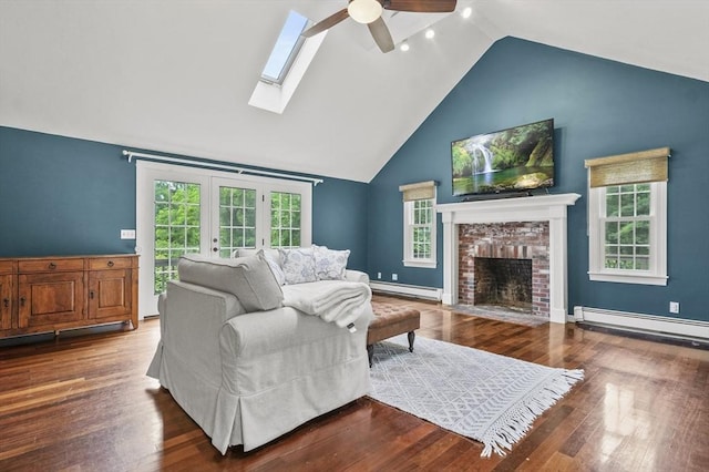 323 School St, Pembroke, MA 02359 - living area featuring baseboard heating, a ceiling fan, high vaulted ceiling, french doors, and a brick fireplace