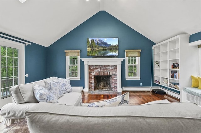323 School St, Pembroke, MA 02359 - living room with wood finished floors, lofted ceiling, and a brick fireplace