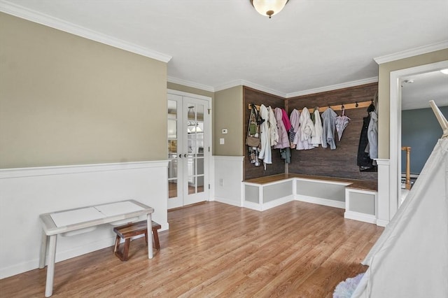 323 School St, Pembroke, MA 02359 - mudroom featuring french doors, wood finished floors, crown molding, and wainscoting