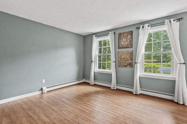 323 School St, Pembroke, MA 02359 - spare room featuring wood finished floors and a baseboard radiator