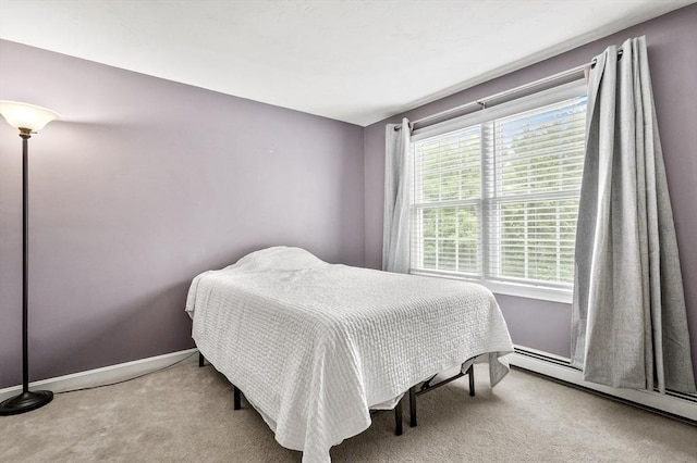 323 School St, Pembroke, MA 02359 - carpeted bedroom with a baseboard heating unit and baseboards