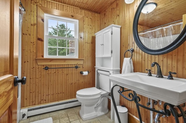 323 School St, Pembroke, MA 02359 - bathroom featuring a baseboard heating unit, wooden ceiling, wooden walls, a shower with shower curtain, and stone finish floors