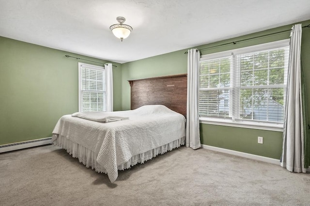 323 School St, Pembroke, MA 02359 - bedroom with a baseboard heating unit and light carpet