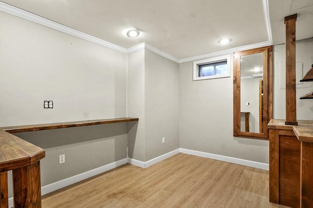 323 School St, Pembroke, MA 02359 - below grade area with wood finished floors, ornamental molding, and recessed lighting