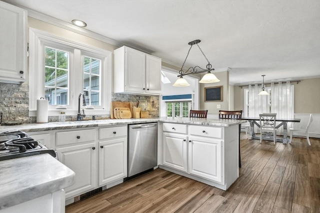 323 School St, Pembroke, MA 02359 - kitchen featuring stainless steel dishwasher, white cabinets, ornamental molding, and a peninsula