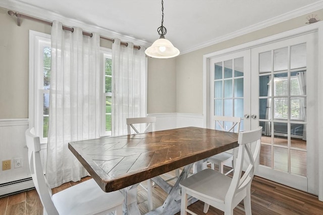 323 School St, Pembroke, MA 02359 - dining space with french doors, plenty of natural light, crown molding, wood finished floors, and a wainscoted wall