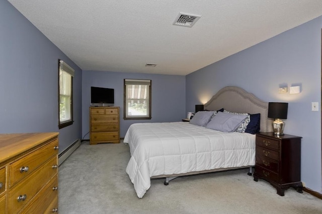 80 Vassar Rd, Agawam, MA 01030 - bedroom featuring a baseboard heating unit, light carpet, and a textured ceiling