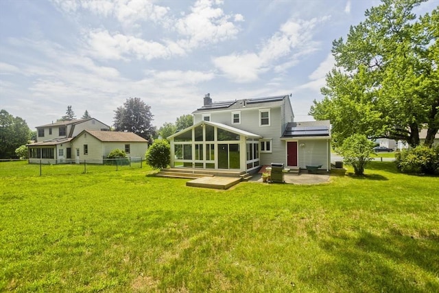 80 Vassar Rd, Agawam, MA 01030 - rear view of property with a sunroom, solar panels, a patio area, a chimney, and entry steps