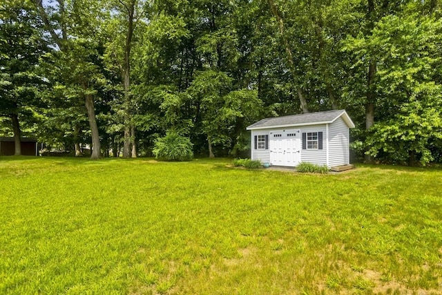 80 Vassar Rd, Agawam, MA 01030 - view of green lawn with an outdoor structure