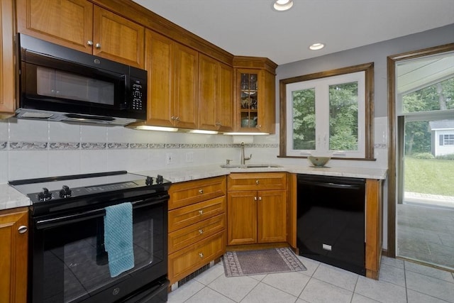 80 Vassar Rd, Agawam, MA 01030 - kitchen featuring black appliances, brown cabinets, backsplash, glass insert cabinets, and recessed lighting