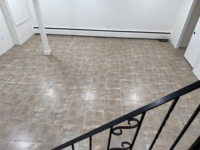 detailed view of a baseboard heating unit and baseboards