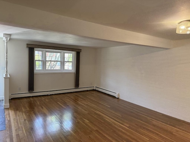 spare room with wood finished floors