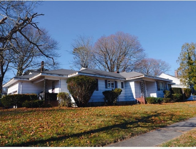 view of home's exterior featuring a yard