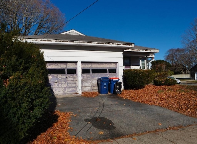 view of property exterior featuring a garage