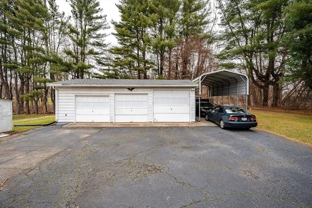 garage featuring a carport