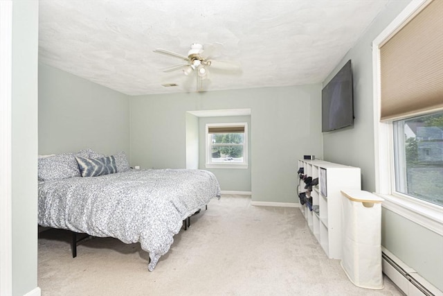 14 Robbins Rd, Ayer, MA 01432 - bedroom featuring a baseboard radiator, light carpet, and a ceiling fan