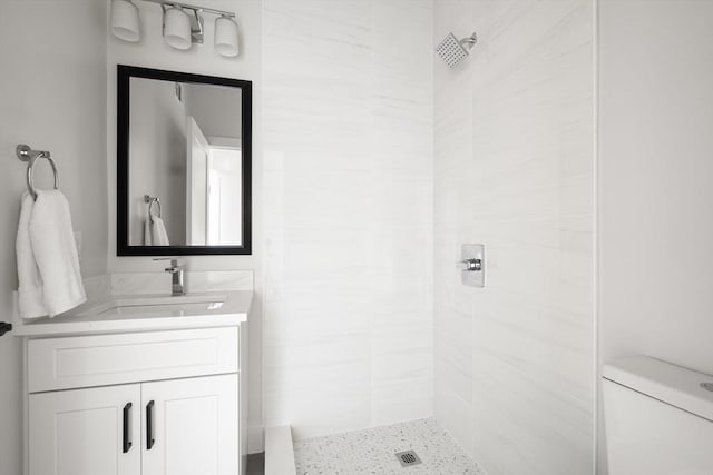 62 Albertina St Unit D, Quincy, MA 02169 - bathroom featuring a tile shower, vanity, and toilet
