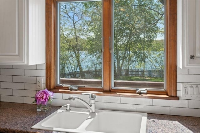 2 Lake Ave, Framingham, MA 01702 - kitchen view of a sink, tasteful backsplash, white cabinets, and dark stone countertops