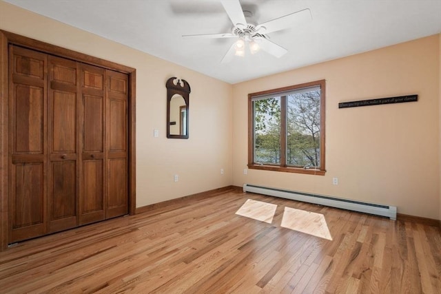 2 Lake Ave, Framingham, MA 01702 - unfurnished bedroom with a baseboard heating unit, light wood finished floors, baseboards, and ceiling fan