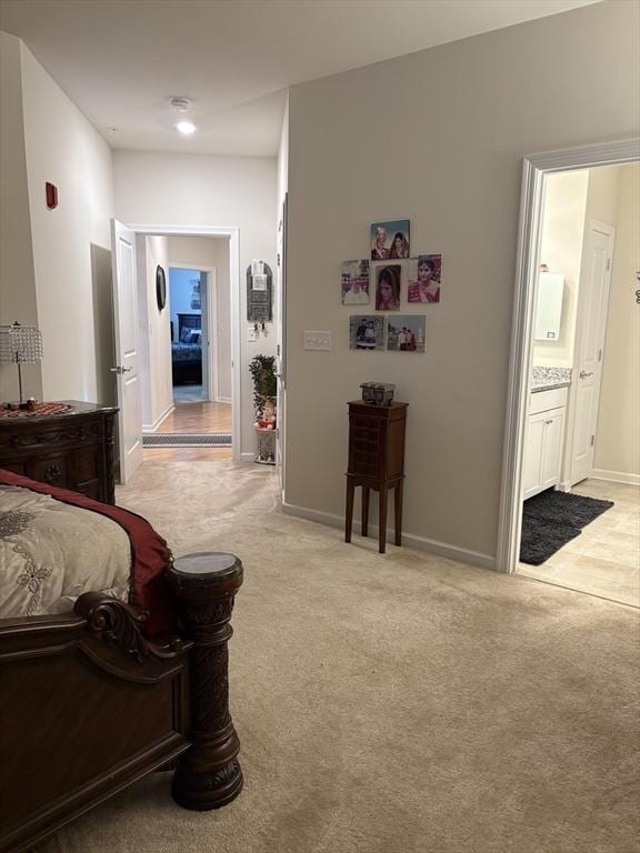 12101 Peters Farm Way Unit 12101, Westborough, MA 01581 - bedroom with light colored carpet, ensuite bathroom, and baseboards
