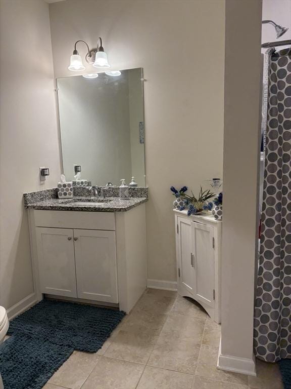 12101 Peters Farm Way Unit 12101, Westborough, MA 01581 - full bath with vanity, toilet, tile patterned floors, a shower with shower curtain, and baseboards