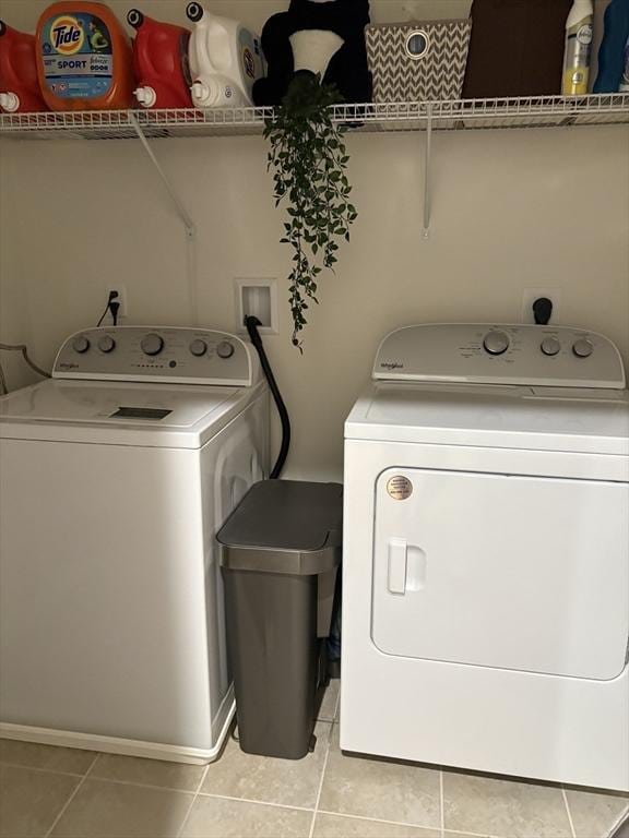 12101 Peters Farm Way Unit 12101, Westborough, MA 01581 - laundry room with light tile patterned floors and washer and dryer