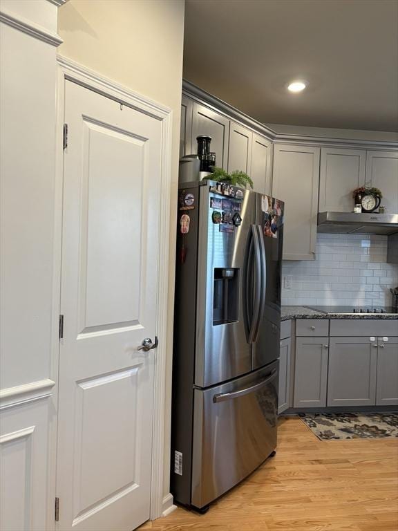 12101 Peters Farm Way Unit 12101, Westborough, MA 01581 - kitchen featuring stainless steel fridge with ice dispenser, gray cabinets, light wood-style flooring, backsplash, and stone counters
