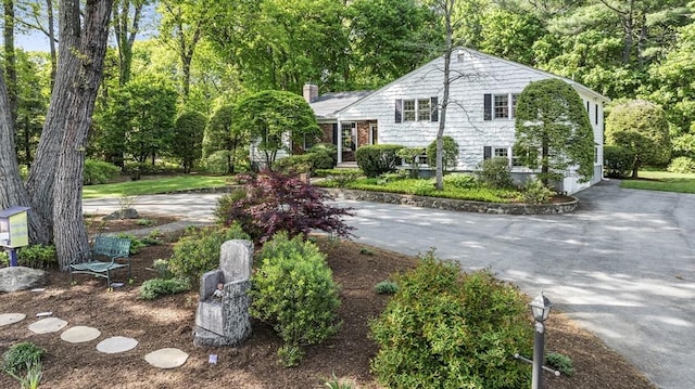 split level home with a chimney